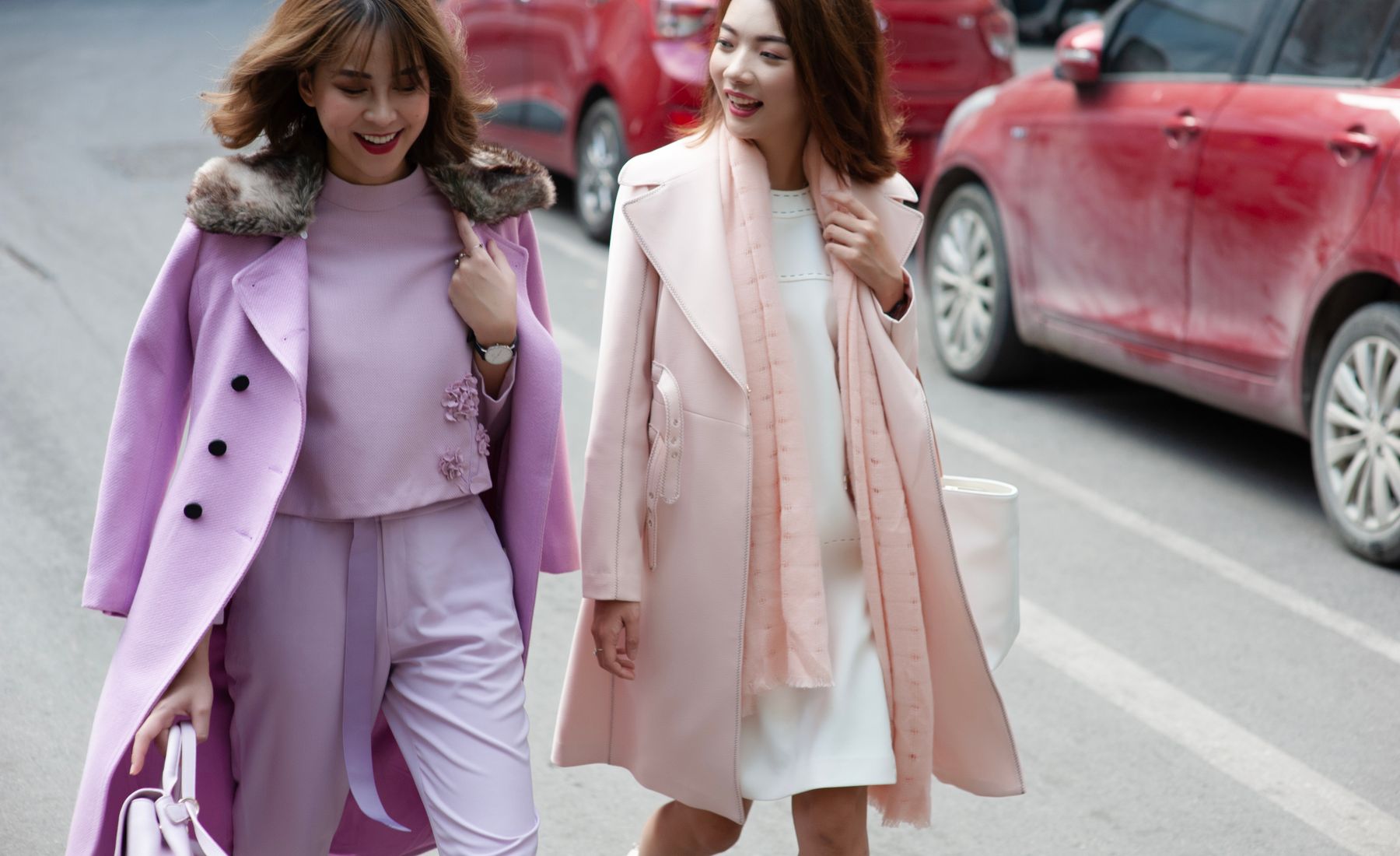 Two women in wool coats on a city street